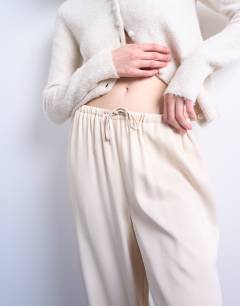 Model wearing Satin tie waist wide leg trouser in ecru