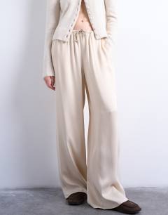 Model wearing Satin tie waist wide leg trouser in ecru