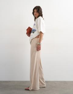 Model wearing Satin tie waist wide leg trouser in ecru