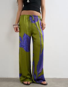 Model wearing Satin tie waist wide leg trouser in green and purple floral