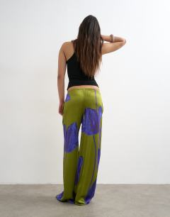 Model wearing Satin tie waist wide leg trouser in green and purple floral
