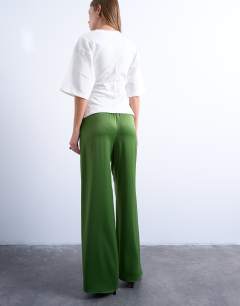 Model wearing Satin tie waist wide leg trouser in green