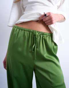 Model wearing Satin tie waist wide leg trouser in green