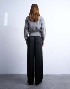 Model wearing Satin tie waist wide leg trouser with pintuck seam detail in black