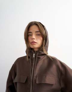 Model wearing Satin twill bomber co ord in brown