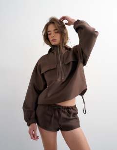 Model wearing Satin twill runner short co ord in brown