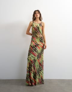 Model wearing Satin twist strap maxi dress in bright animal