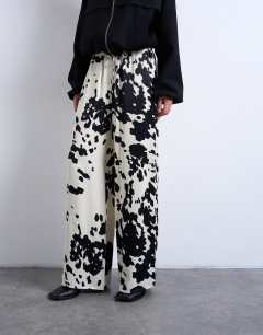 Model wearing Satin wide leg with tie waist trouser in cow print