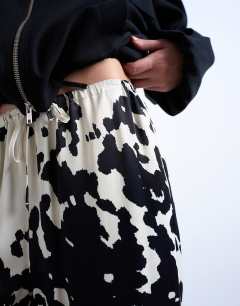 Model wearing Satin wide leg with tie waist trouser in cow print