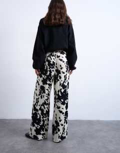 Model wearing Satin wide leg with tie waist trouser in cow print