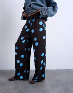 Model wearing Satin wide leg with tie waist trouser in polka dot