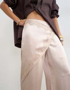 Model wearing Satin wrap around lace detail trouser in oyster