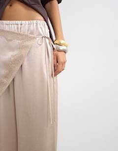 Model wearing Satin wrap around lace detail trouser in oyster