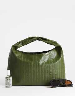 Model wearing Savan woven small shoulder bag in green