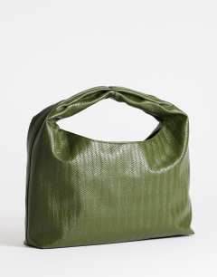 Model wearing Savan woven small shoulder bag in green