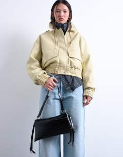 Model wearing Saxon textured shoulder bag in black