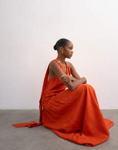 Model wearing Scarf neck plunge maxi dress with hardware in orange