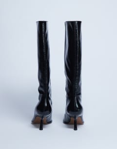 Model wearing Scarlett Premium leather square toe knee high boot in black