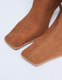 Model wearing Scarlett Premium leather square toe knee high boot in tan