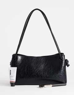 Model wearing Schelby medium flat bowler in black