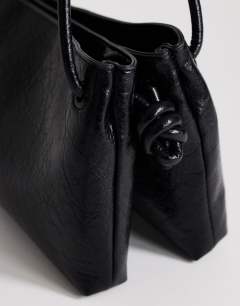 Model wearing Schelby medium flat bowler in black