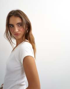 Model wearing Scoop v baby tee in white