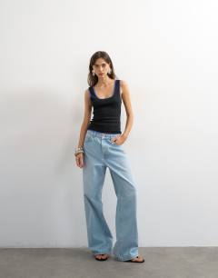 Model wearing Scoop vest with contrast mesh tipping in black and blue