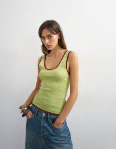 Model wearing Scoop vest with contrast mesh tipping in green & plum