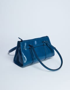 Model wearing Scottie shoulder bowler bag in teal