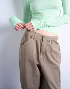 Model wearing Seam detail barrel leg trouser in mushroom