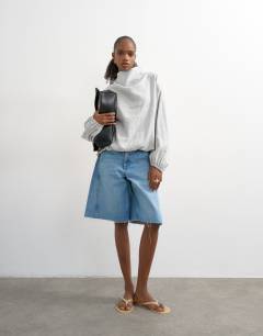 Model wearing Seam detail cuffed long sleeve top in grey