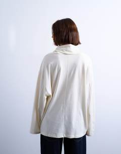 Model wearing Seam detail funnel neck skater tee in ecru
