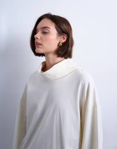 Model wearing Seam detail funnel neck skater tee in ecru
