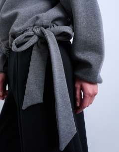 Model wearing Seam detail tie hem hoodie in charcoal marl