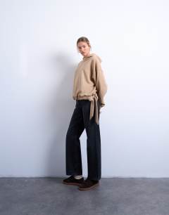 Model wearing Seam detail tie hem hoodie in tan