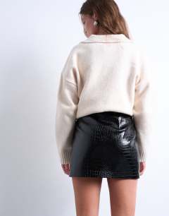 Model wearing Seamed detail faux leather mini in black