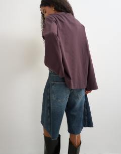 Model wearing Seamed detail long sleeve skater top in chocolate plum