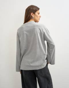 Model wearing Seamed detail long sleeve skater top in grey marl