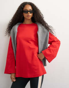 Model wearing Seamed detail long sleeve skater top in red