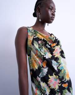 Model wearing Seamed high cowl neck maxi dress in vibrant vintage floral