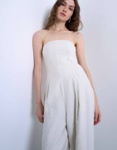 Model wearing Seamed wide leg linen jumpsuit in natural