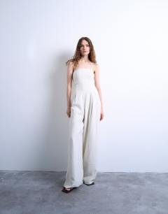Model wearing Seamed wide leg linen jumpsuit in natural