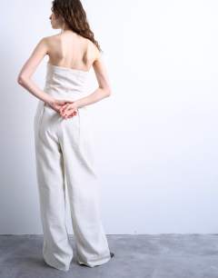 Model wearing Seamed wide leg linen jumpsuit in natural