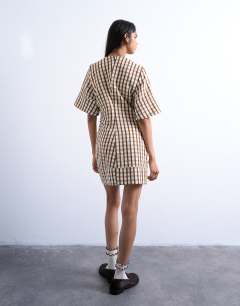 Model wearing Seersucker T-shirt mini dress in brown check