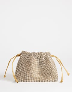 Model wearing Seleena small diamante drawstring clutch bag in gold