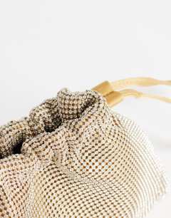 Model wearing Seleena small diamante drawstring clutch bag in gold