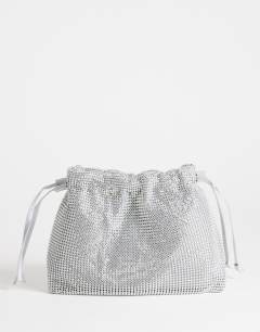 Model wearing Seleena small diamante drawstring clutch bag in silver
