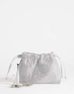 Model wearing Seleena small diamante drawstring clutch bag in silver