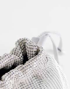 Model wearing Seleena small diamante drawstring clutch bag in silver