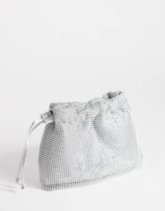 Model wearing Seleena small diamante drawstring clutch bag in silver